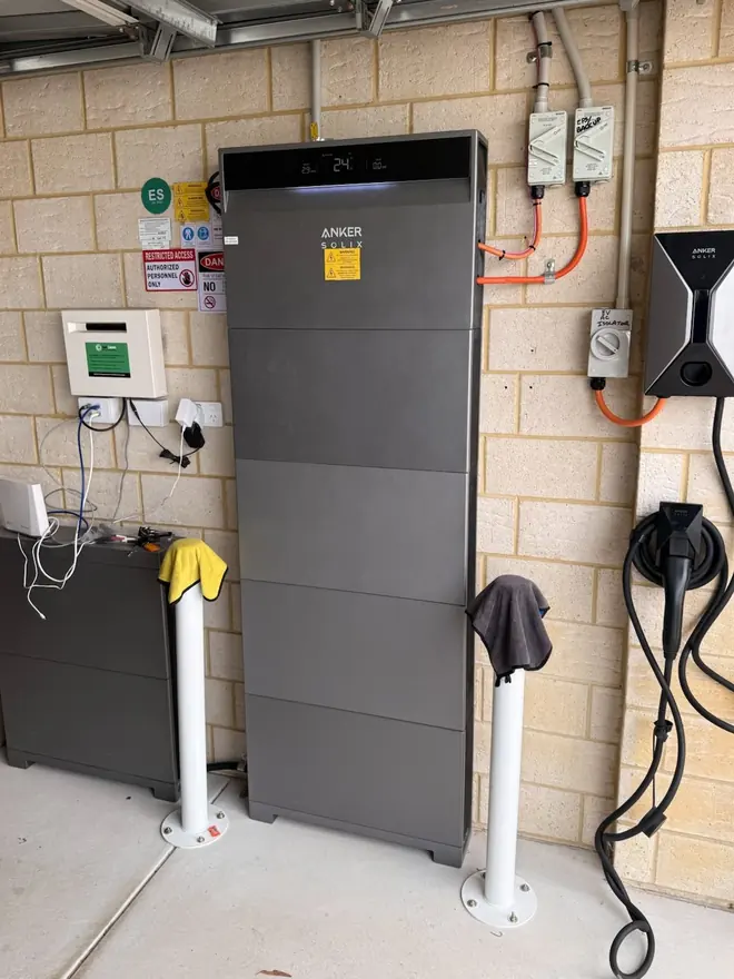 Anker home battery with two EV chargers installed in a garage