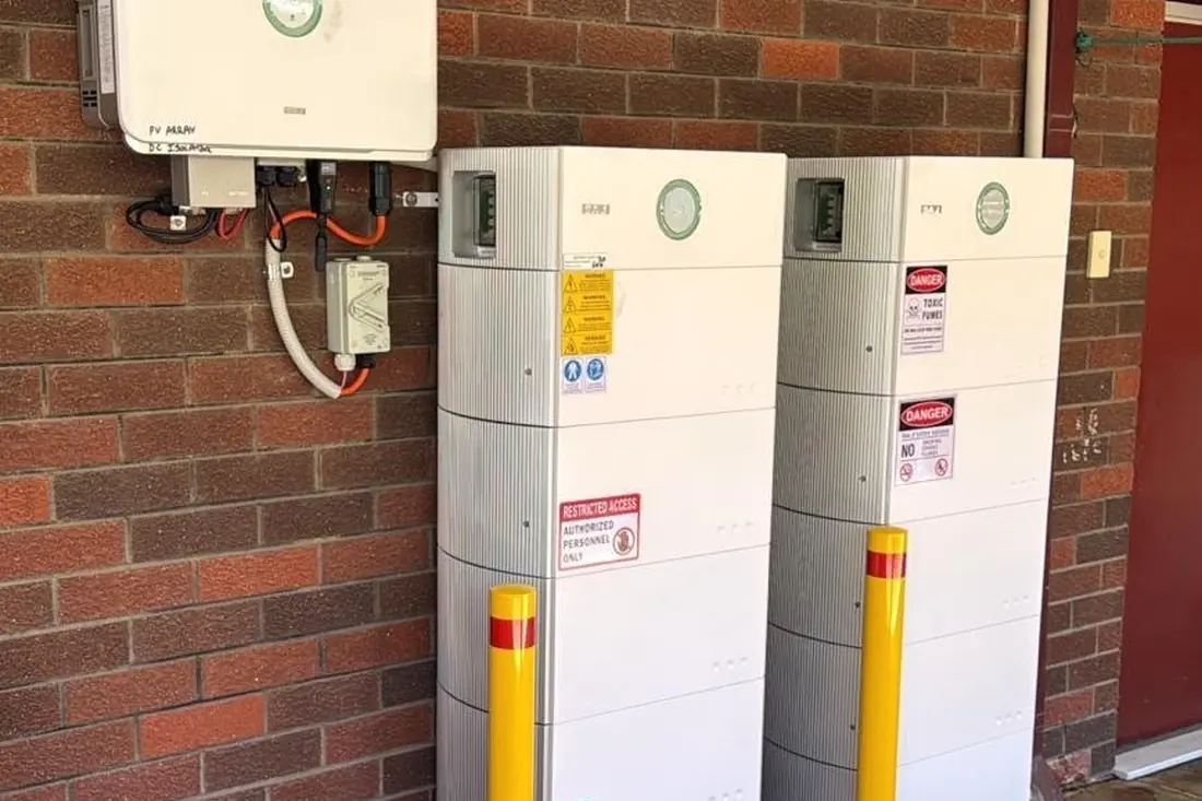 Dual battery system and inverter installed outdoors with safety bollards