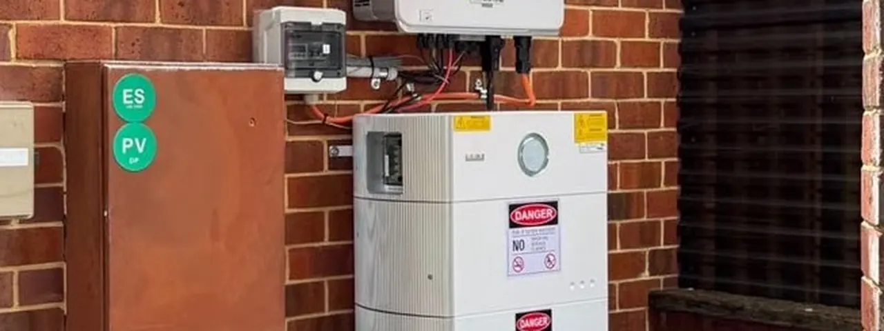 Inverter, battery and switchboard neatly installed on a red brick wall by RZ Solar & Battery